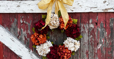 Adding a bow to a wreath, hanging a wreath with a bow