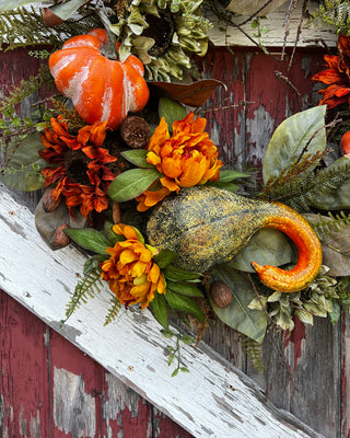 Fall wreath with gourds, pumpkins, peonies, and sunflowers