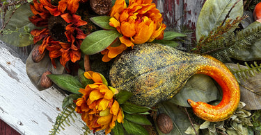 Fall wreath with gourds, pumpkins, peonies, and sunflowers