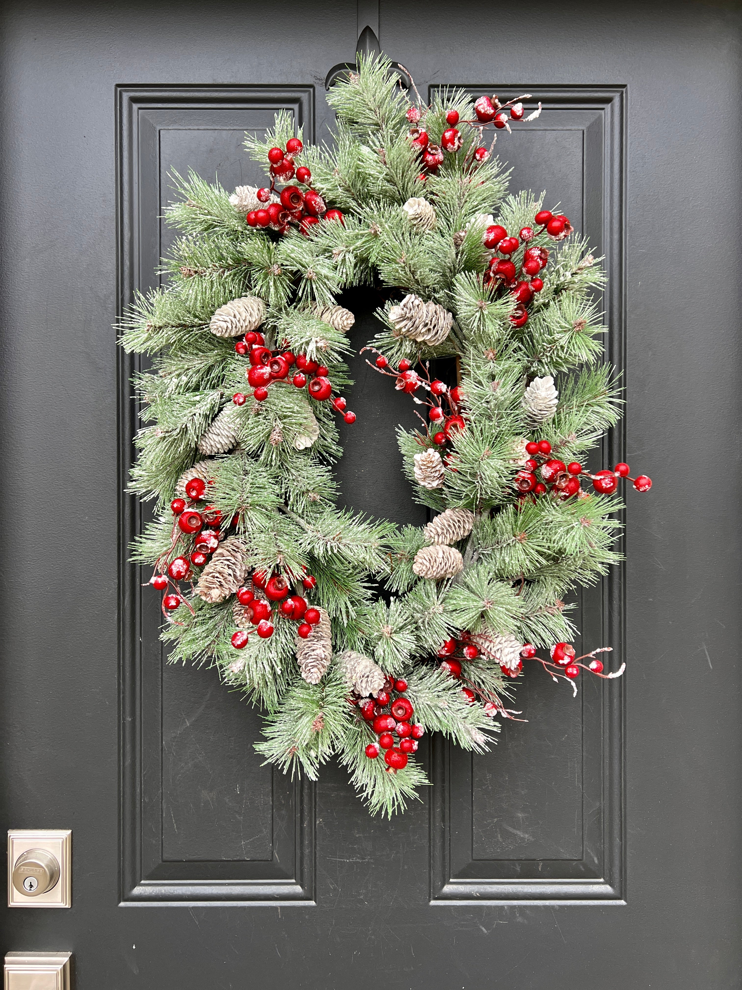 Oval Flocked Winter Pine Wreath with Red Berries and Pinecones