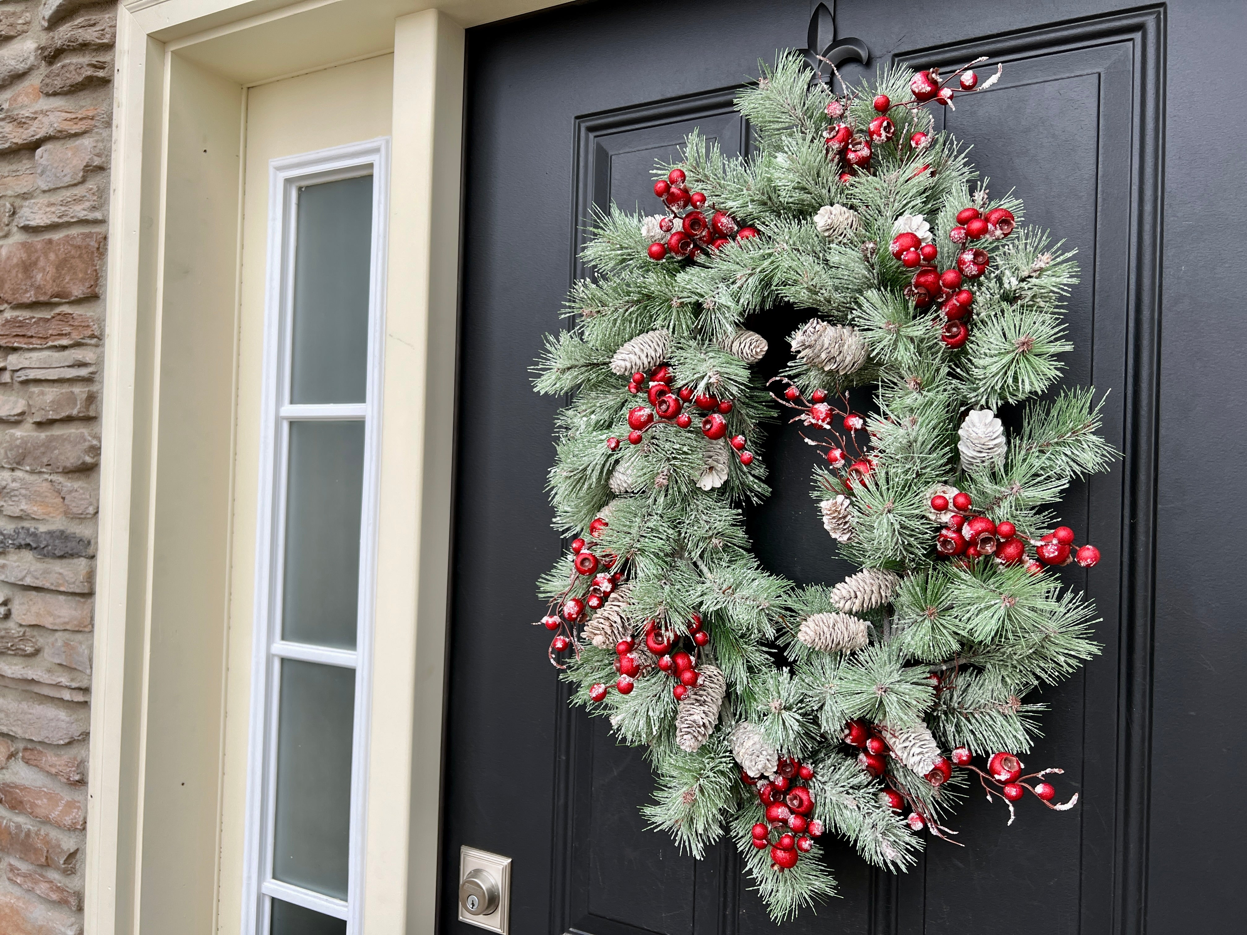 Oval Flocked Winter Pine Wreath with Red Berries and Pinecones