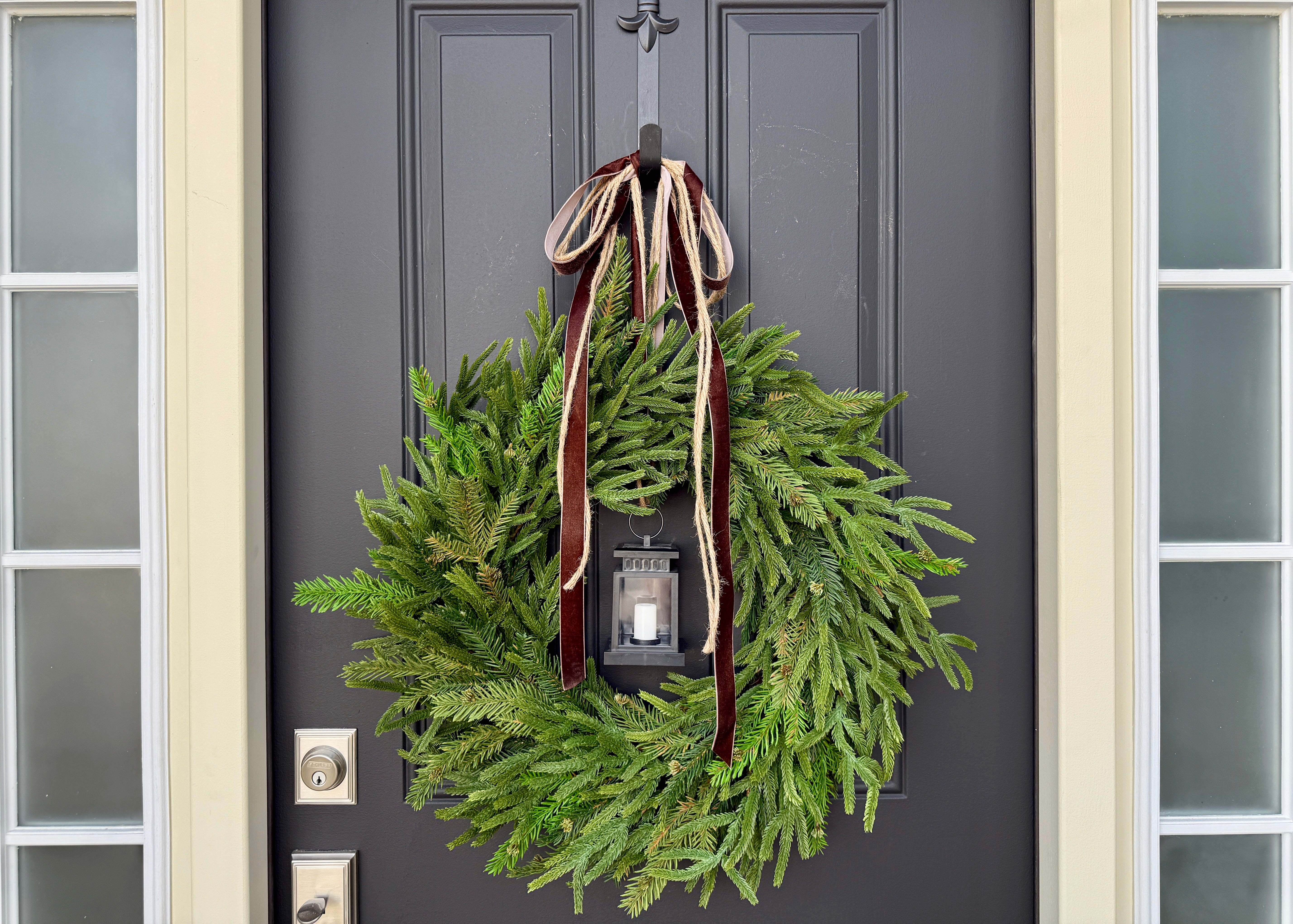 Norfolk Pine & Lantern Christmas Wreath with Velvet Ribbon – Elegant Winter Door Decor |