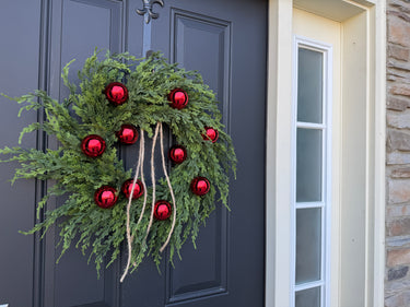 Red Ornament Christmas Wreath with Cascading Pine Greenery