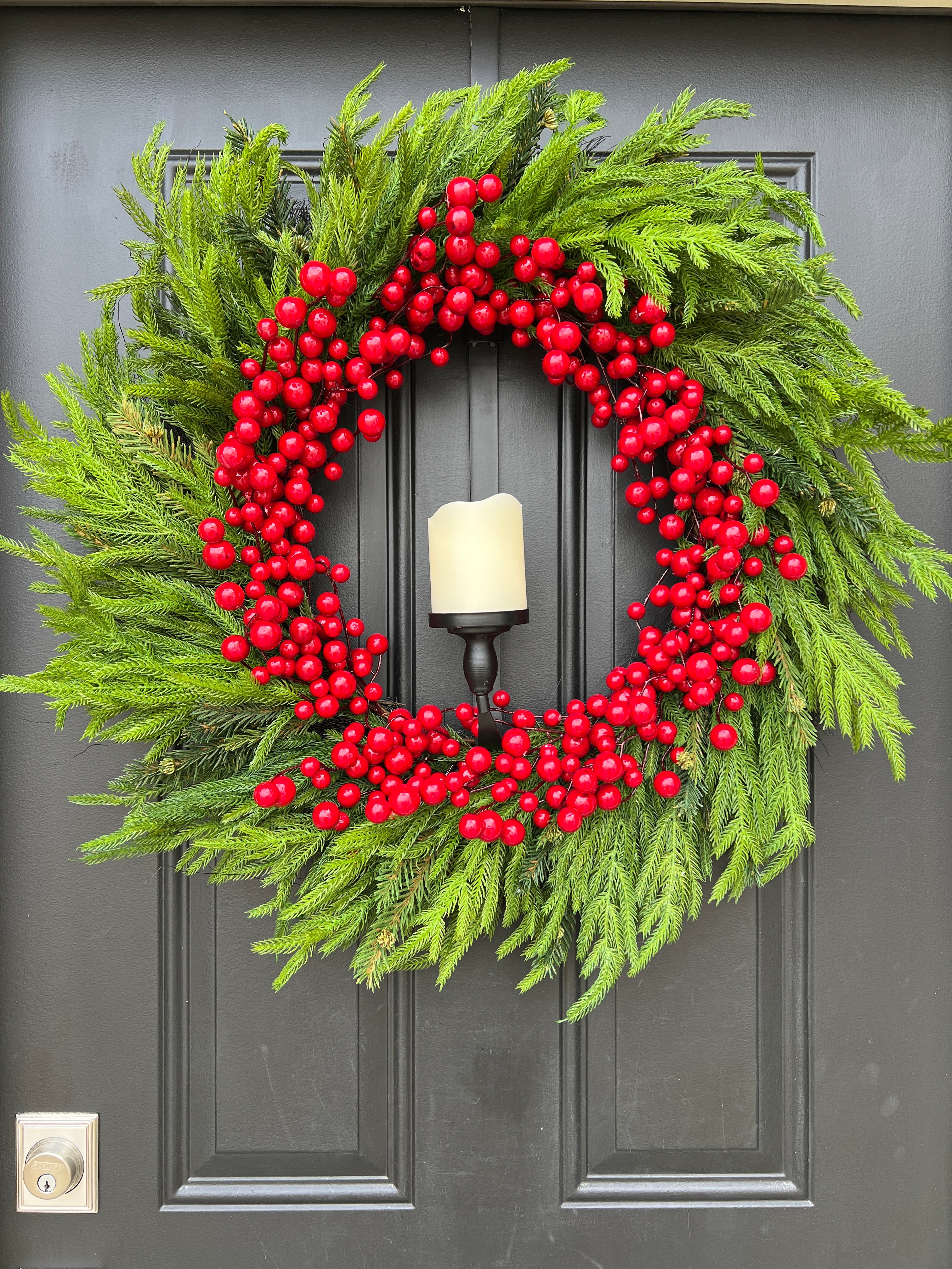 Pine and Berry Wreath with Flickering Flame Candle