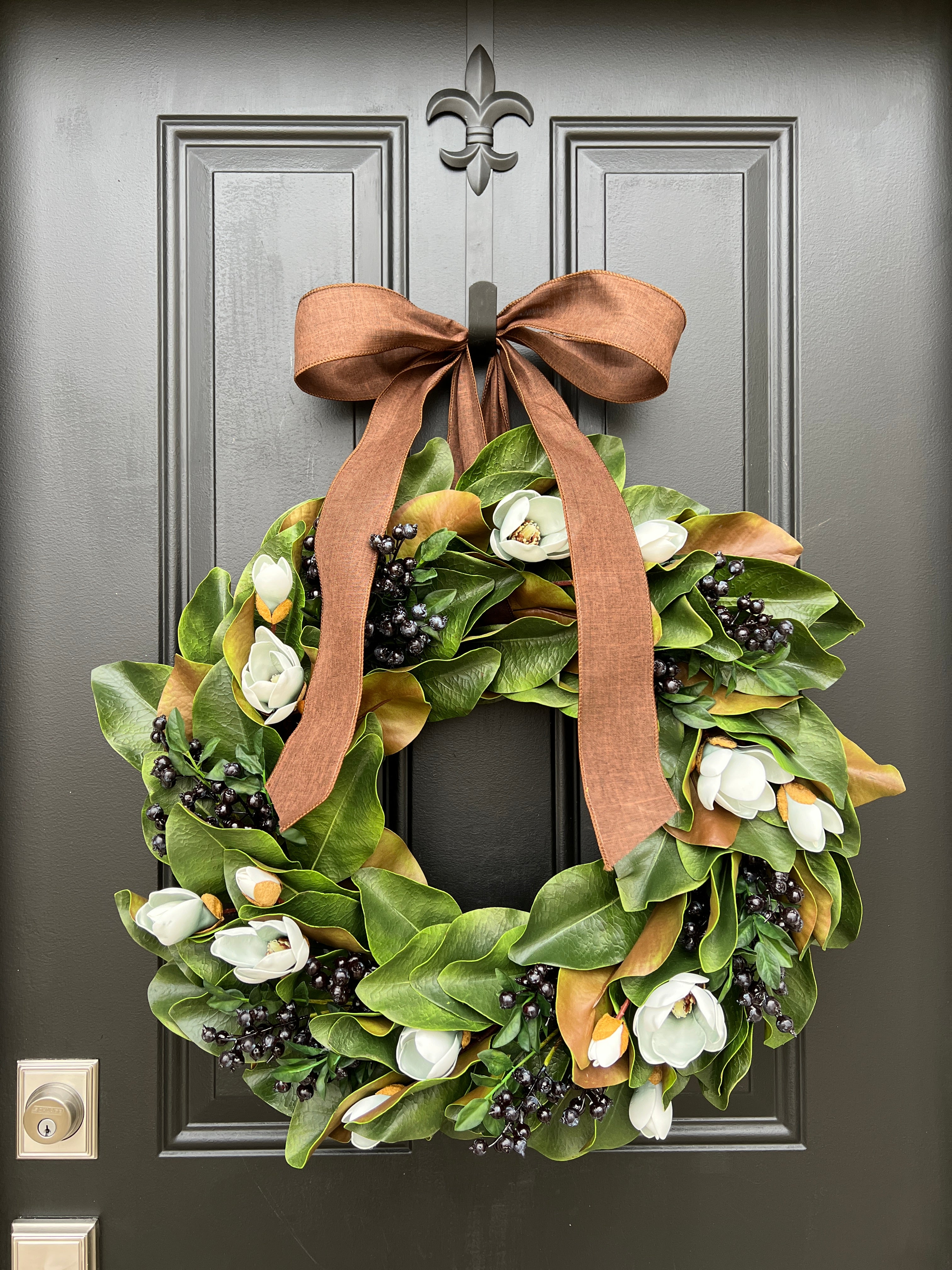 Blue Magnolia Wreath with Blue Berries and Brown Linen Ribbon