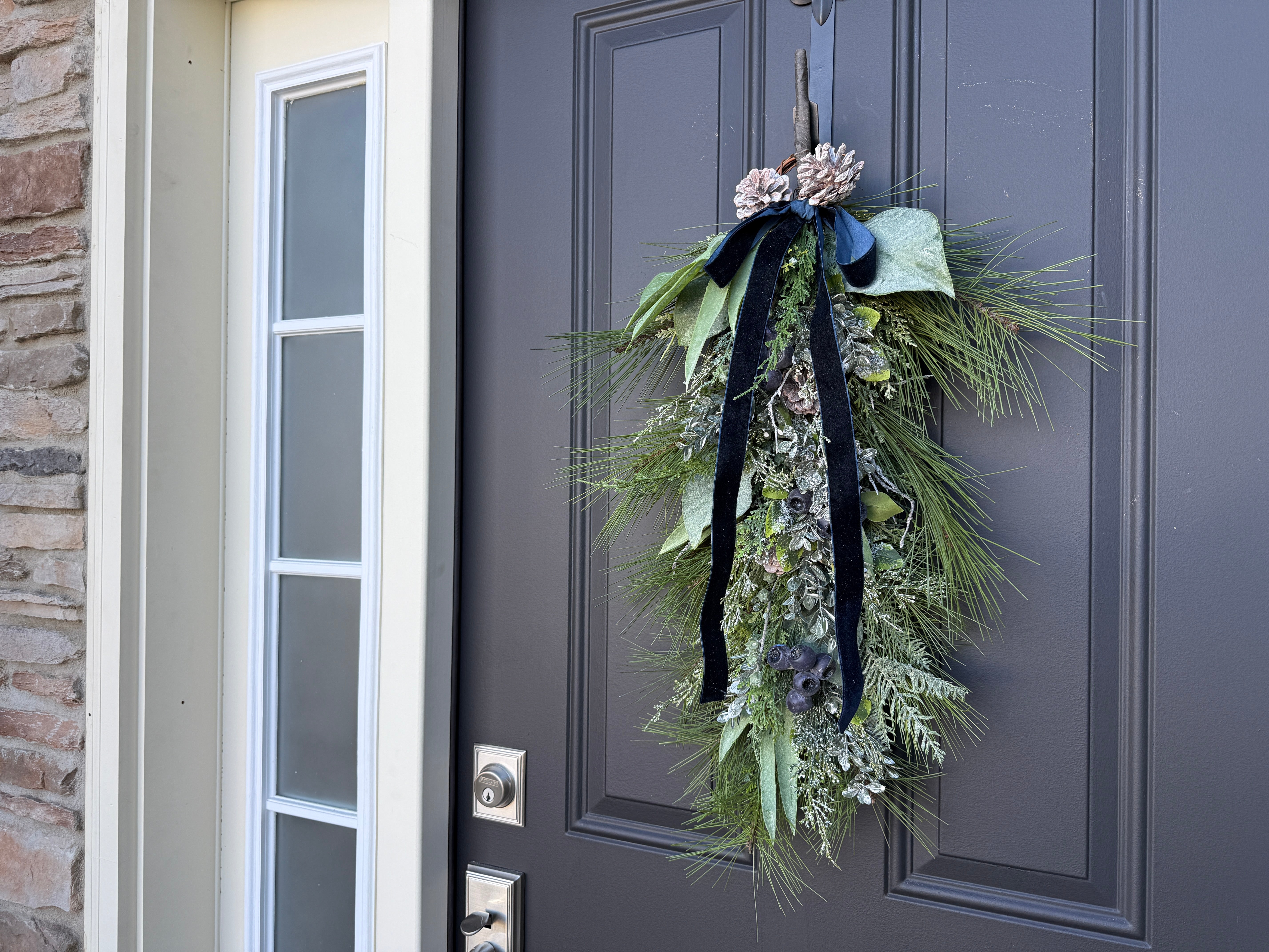 Winter Pine & Blueberry Swag with Black Velvet Ribbon – Elegant Door Accent