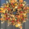 Fall Front Door Wreath with Fall Foliage and Orange Pods - TwoInspireYou