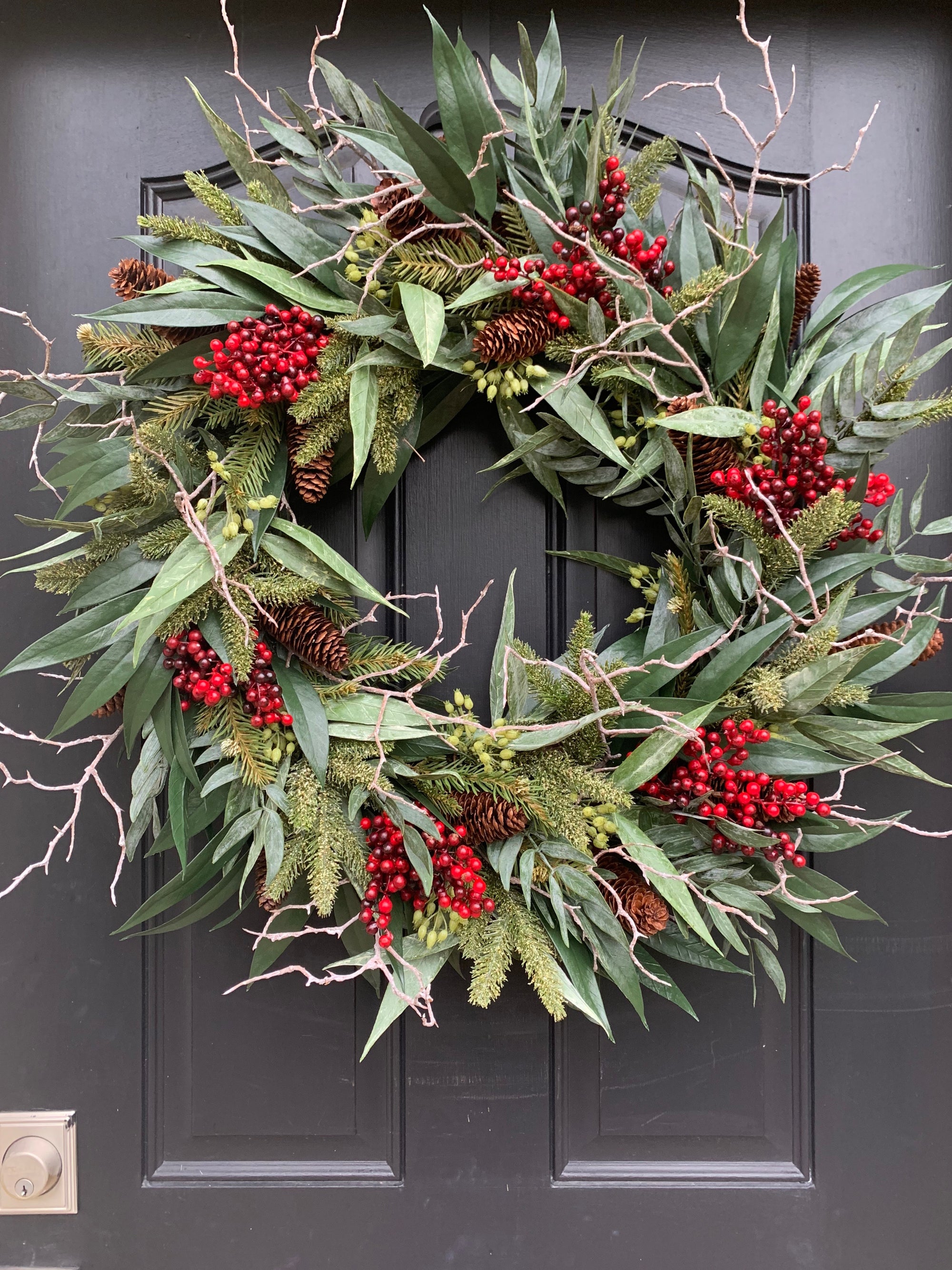 Bayleaf, pine and red berry winter wreath