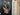 Eucalyptus and ranunculus wreath, left angle view, black front door, spring and summer wreath